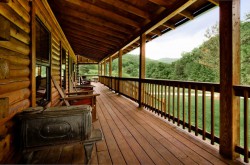 Front porch on cabin with 4 rocking chairs